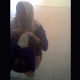 A Muslim girl wearing a hijab is recorded by a hidden camera as she takes a shit into a public floor toilet. A subtle plop is heard. Presented in 720P vertical HD format, although video quality is somewhat dark and grainy. Over 6 minutes.